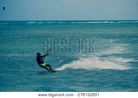 Mui Ne, Vietnam - 05 2019: Kitesurfing, Kiteboarding, Kite Surf. Extreme Sport Kitesurfing In Tropic