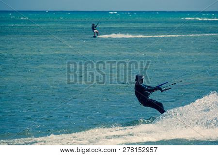 Mui Ne, Vietnam - 11 2018: Kitesurfing, Kiteboarding, Kite Surf. Extreme Sport Kitesurfing In Tropic