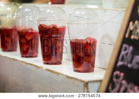 Strawberry And Syrup In The Plastic Glass Show On The Shelf Prepare For Made To Smoothies By The Cus