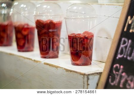 Strawberry And Syrup In The Plastic Glass Show On The Shelf Prepare For Made To Smoothies By The Cus