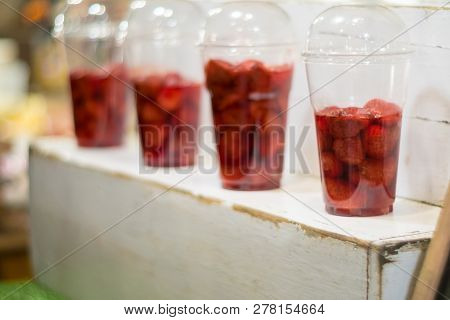 Strawberry And Syrup In The Plastic Glass Show On The Shelf Prepare For Made To Smoothies By The Cus