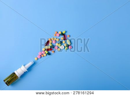Pills Capsules Nose Nasal Spray Medicine Health On Blue Background Top View, Medical Pharmacy Concep