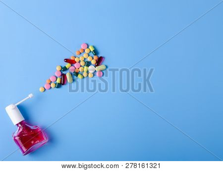 Pills Capsules Throat Spray Medicine Health On Blue Background Top View, Medical Pharmacy Concept