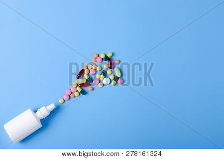 Pills Capsules Nose Nasal Spray Medicine Health On Blue Background Top View, Medical Pharmacy Concep