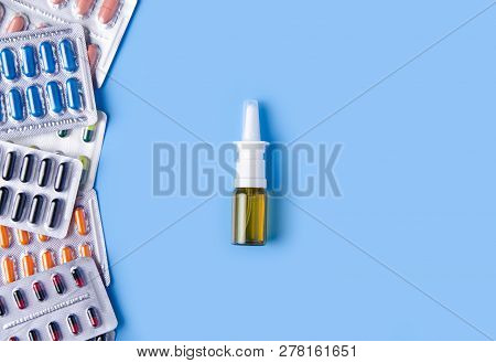 Pills Capsules Nose Nazal Spray Thermometer Medicine Health On Blue Background Top View, Medical Pha