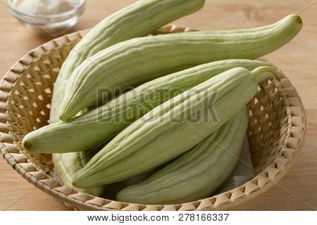 Basket with fresh raw Armenian cucumbers  