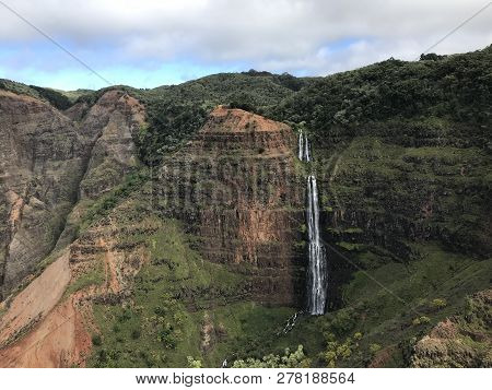 Waterfall Shot From A Helicopter Over The Waimea Canyon In Kauai