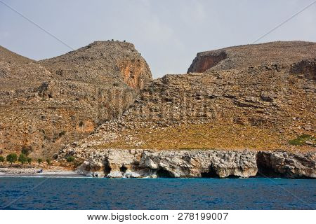View From The Sea On Marmara Beach And Entrance To Aradena Gorge, South-west Coast Of Crete Island, 