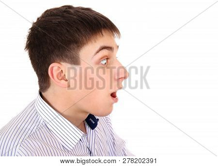Side View Of A Surprised Young Man On The White Background Closeup