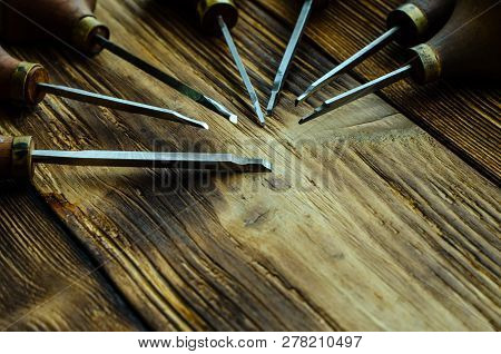 Different Gravers For Jewelry On A Wooden Background