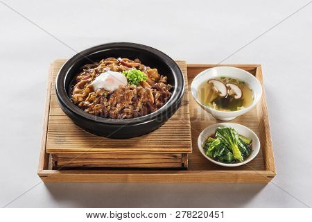Japanese Pork With Rice Set Meal In A Wood Dish