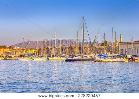 Travel Concepts. Picturesque Image Of Old Venetian Harbour Of Chania With Line Of Fisihing Boats And