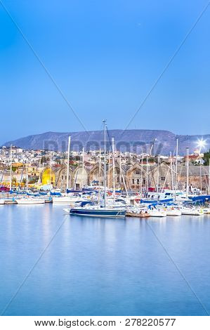 Travel Concepts. Picturesque Image Of Old Venetian Harbour Of Chania With Line Of Fisihing Boats And