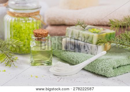 Natural Cosmetic Oil, Sea Salt, Facial Mask And Natural Handmade Soap With Coniferous Extract On Whi