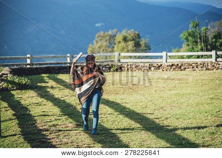 Asian Woman Relax In The Holiday. Travel Nature And  Write A Note In The Notebook At The Park On The