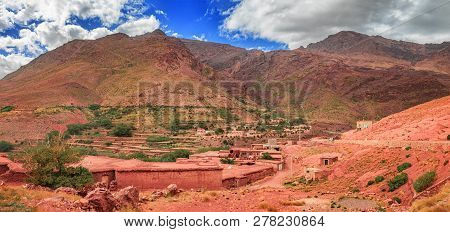 Old Berber Architecture In High Atlas Mountains Region In Morocco. Houses Of Clay At The Foot Of The