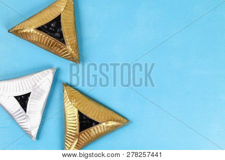 Purim. Diy Cookies Hamantaschen Of Cardboard Plates With Sweet Surprise Inside On Blue Background. G