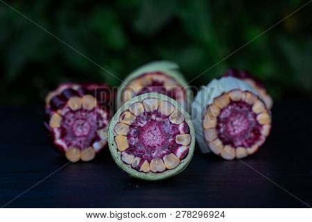 Fresh Purple Corn Fruit Isolate On White Cut Haff