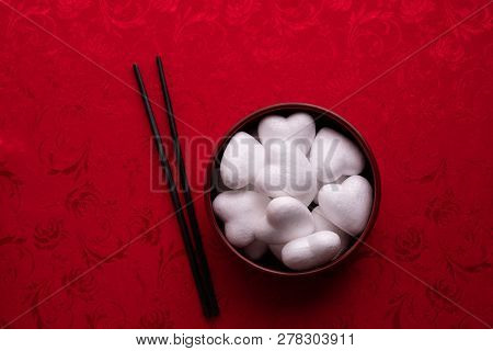 White Heart Shape On Plate With Red Background, Valentine's Day Holiday Celebration.