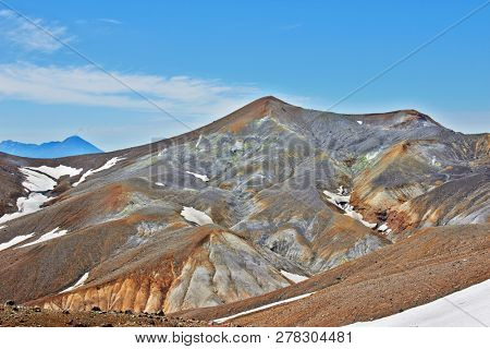 Fumarole field in Ebeko volcano caldera. Emission of hot sulfur gas.