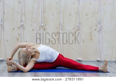 Beautiful Young Woman Practices Yoga Asana Samakonasana Straight Angle Posture