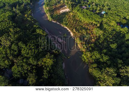 Green Nature Scenic Of Rain Forest With Curve Of River Sunrise