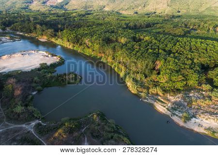 Green Nature Scenic Of Rain Forest With Curve Of River Sunrise