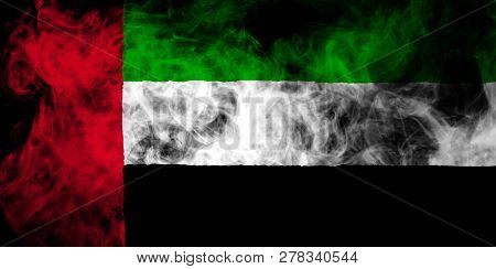 National Flag Of Unired Arab Emirates From Thick Colored Smoke On A Black Isolated Background
