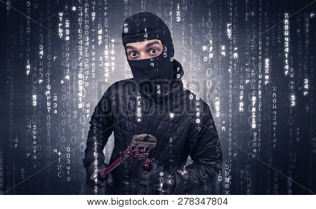 Burglar in action with encoded concept and his tools in his hand. 