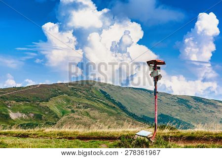 Metal Track Pointer On The Road In The Carpathian Mountains.