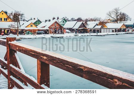 View From The Bridge To Lake Galve And Streets Of Trakai. Lithuania In Winter.
