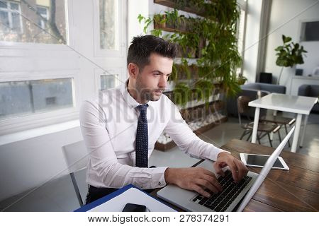Businessman Working On Laptop In The Office