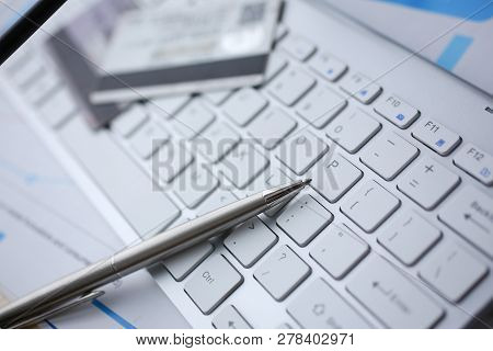 Silver Pen With Credit Card Lie White Keyboard Pc Buttons Closeup. Financial Transfer Security When 