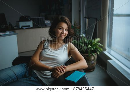 Portrait Of Smiling Young Business Woman In The Office