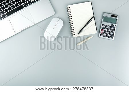 Top View Office Table Desk.table Workspace With Office Accessories Including Laptop Computer With Mo