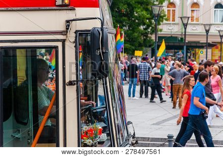 Vilnius, Lithuania - July 27, 2013: Woman Driving Trolleybus On Foreground During The Pride Parade O