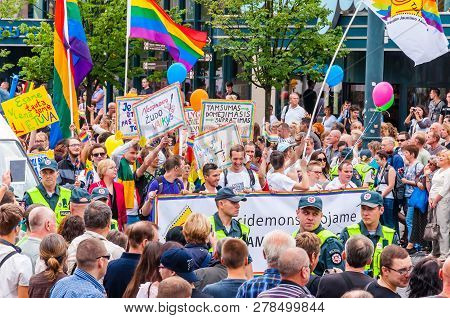 Vilnius, Lithuania - July 27, 2013: Pride Parade In Action. Crowd Of Watchers And Demonstrators With