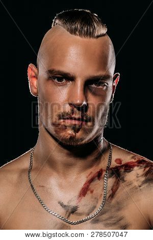 Fight club, MMA. Portrait of a bad guy fighter with a face in the blood. Rocker, punk. 
