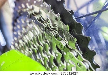 Bike Chain Links Over Chainrings On Mtb. Closeup. Selectuiva Focus