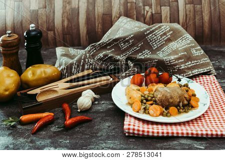Beef meat stewed with potatoes-Traditional French cuisine Beef Bourguignon potatoes carrots in persillade