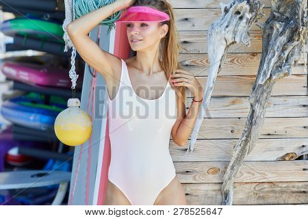 Woman With Her Surfboard At The Beach Stock Photo 