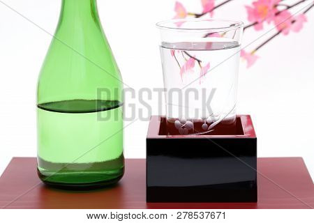 Japanese Wooden Box Masu With Sake Isolated On White Background