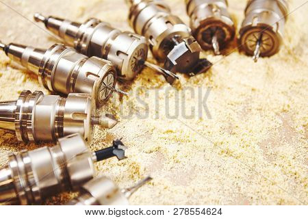 Woodworking Bits For Router Machine On Sawdust.