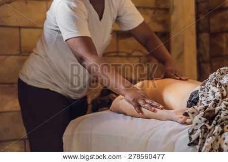 Total Relaxation. Beautiful Young Wwoman Get Balinese Or Thai Massage