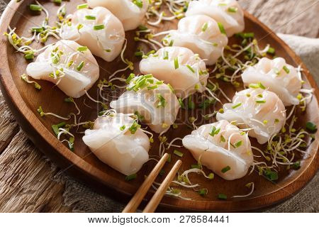 Dumplings Dim Sum Stuffed With Shrimp Served With Sprouts Close-up On A Plate. Horizontal
