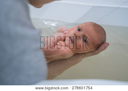 Watsu Therapy. Healing Massage In Warm Water For Baby.