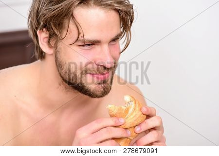 Sleeping Man Being Woken By Mobile Phone In Bedroom. Handsome Young Man Enjoying His Morning Cup Of 
