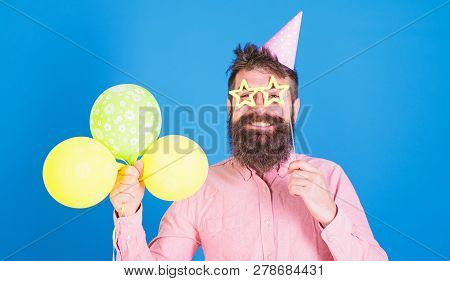 Balloon Artist At Birthday Party. Bearded Man Entertaining Kids At International Children Day Celebr