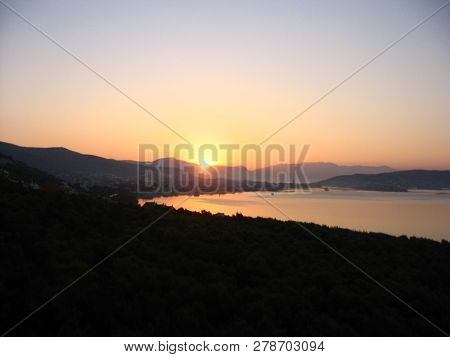 Harmonious View Of Colorful Dawning At The Adriatic Coast