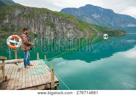 Stryn, Norway - 26.06.2018: Fisherman On Oppstrynsvatn Is A Lake In The Municipality Of Stryn In Sog